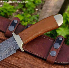 Bronze hilt & pommel of hunting knife with leather wrapped handle.