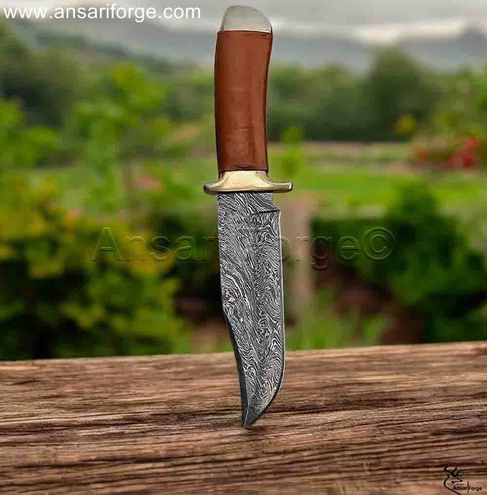 Hand-forged Damascus Hunting Knife with intricately patterned blade.