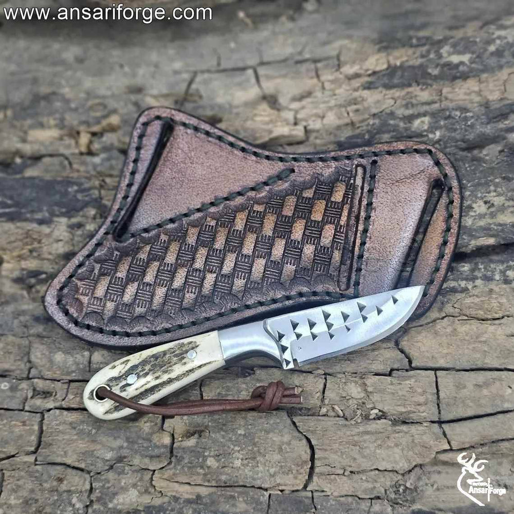 Cowboy knife and sheath with stag antler handle and leather pancake sheath.