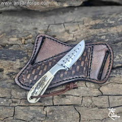 Close-up of Farrier rasp steel blade on cowboy knife and sheath.
