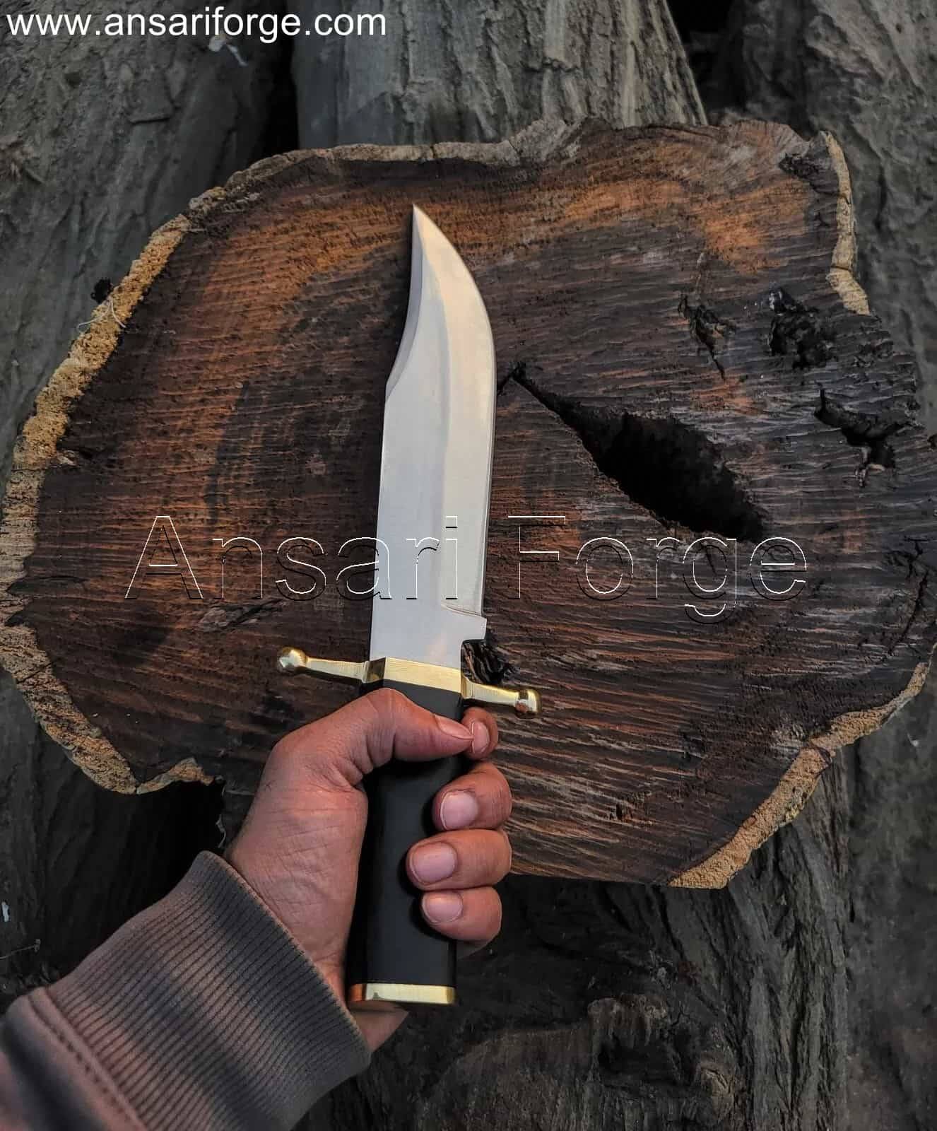 Hand-forged Smithsonian Bowie Knife with 5160 steel clip point blade, brass guard, buffalo horn handle, and leather sheath. Overall length 16 inches.