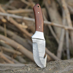 Close-up view of the 4.5-inch drop point blade made from 1095 and 15N20 Damascus steel, highlighting the 512-layer twist pattern.