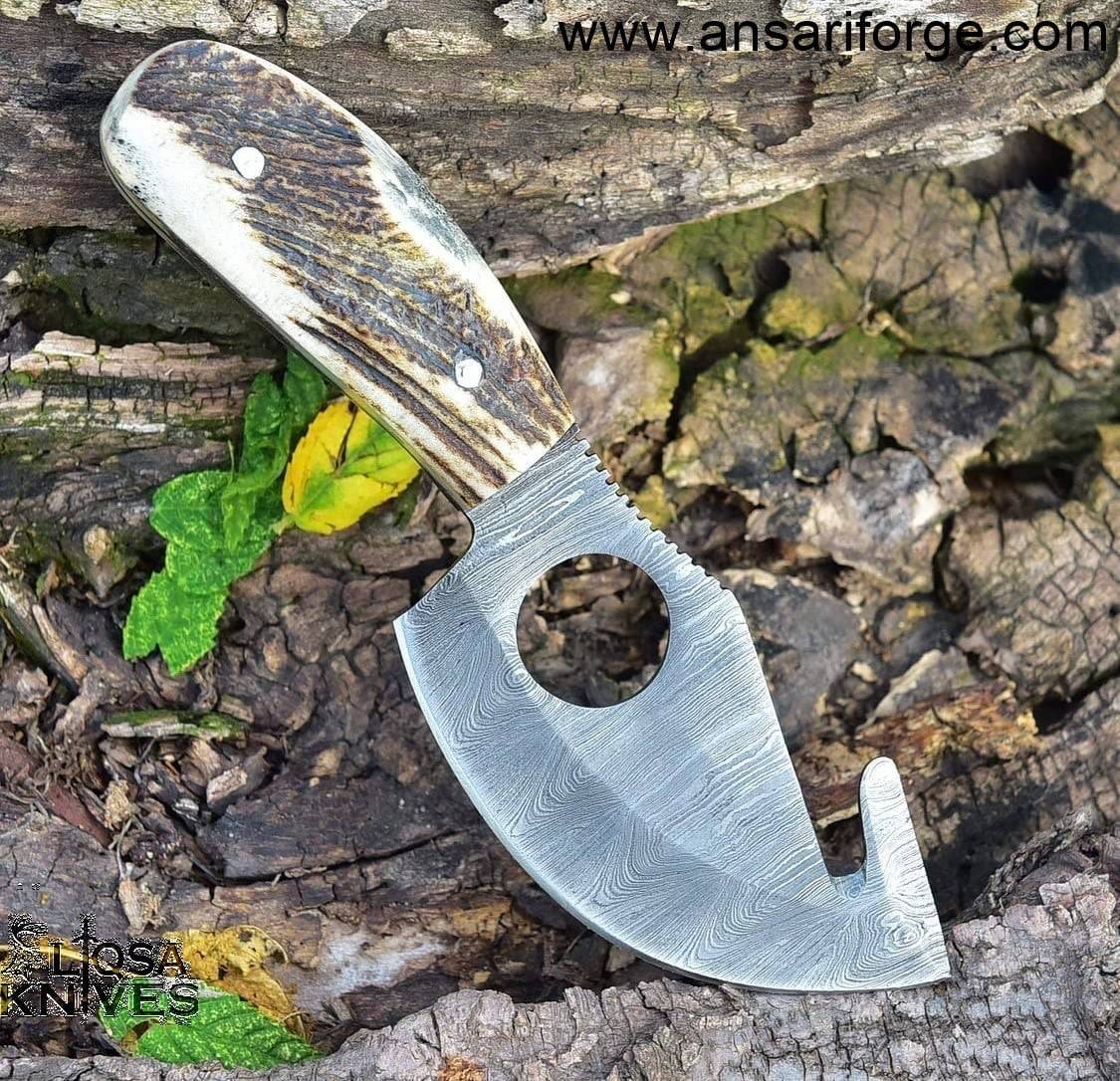 Detailed image of the stag antler handle of the Damascus skinning knife, highlighting its unique texture and design.