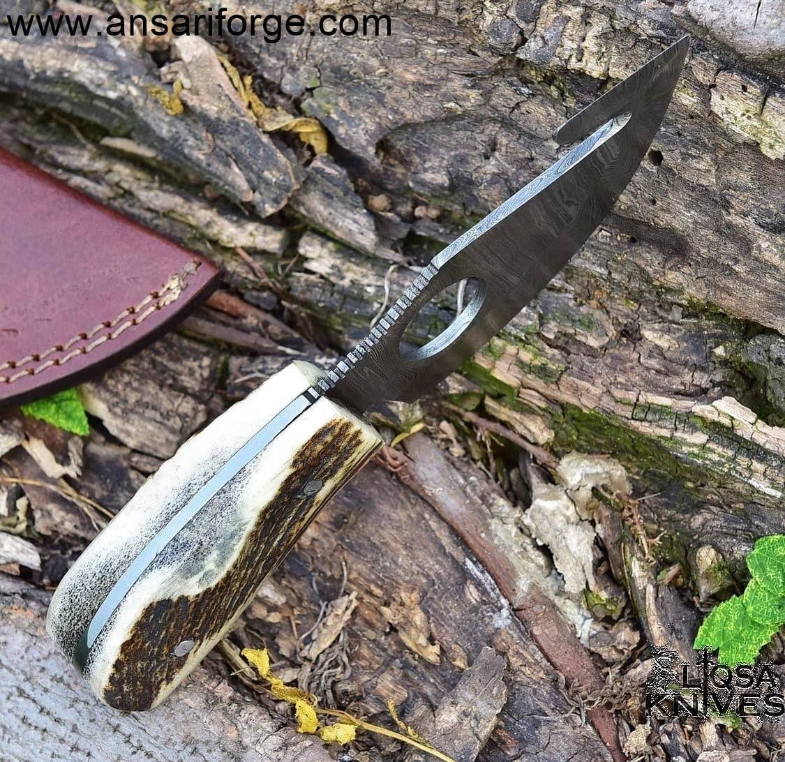 Close-up view of the full tang 3.5-inch drop point blade showcasing the intricate twist pattern of 512 layers of Damascus steel.