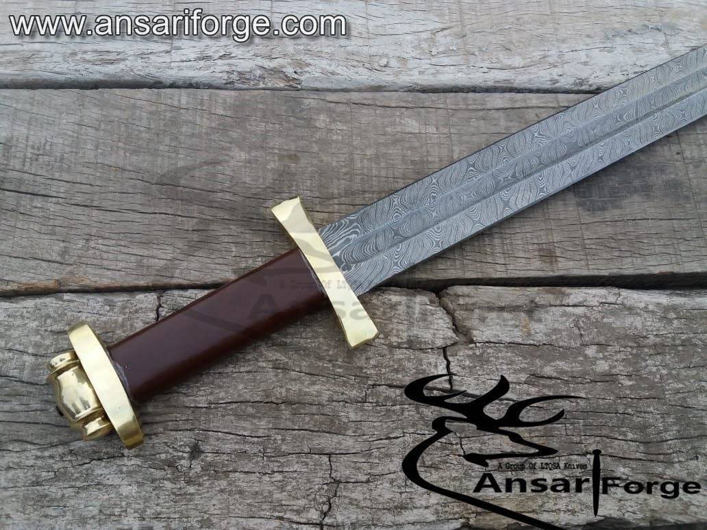 rass hilt and leather wrapped wooden handle of Damascus sword.
