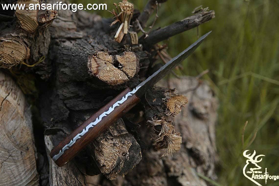 Handmade Damascus steel hunting deer skinning knife with leather sheath .