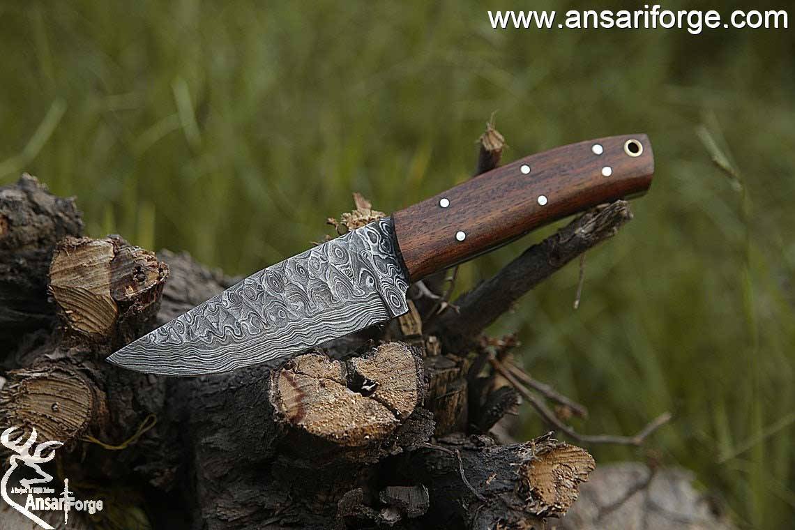 Handmade Damascus steel hunting deer skinning knife with leather sheath .