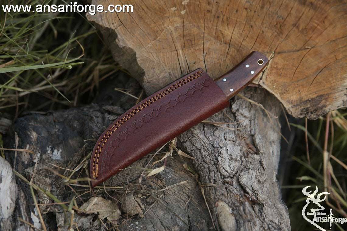 Handmade Damascus steel hunting deer skinning knife with leather sheath .