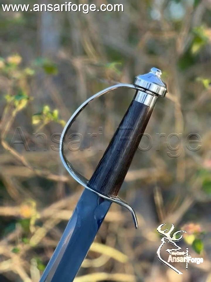 Ebony handle of pirate cutlass sword ergonomic design.