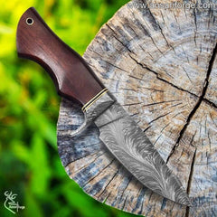 Close-up of the Best Hunting Knife showcasing the intricate feather pattern Damascus steel blade and ergonomic walnut wood handle.