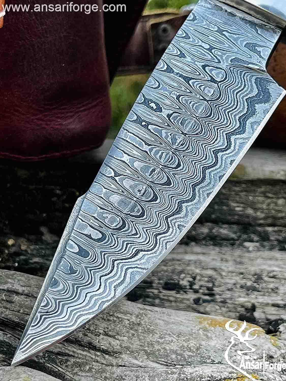 Close-up of a Damascus Hunting Bowie Knife with a ladder pattern.