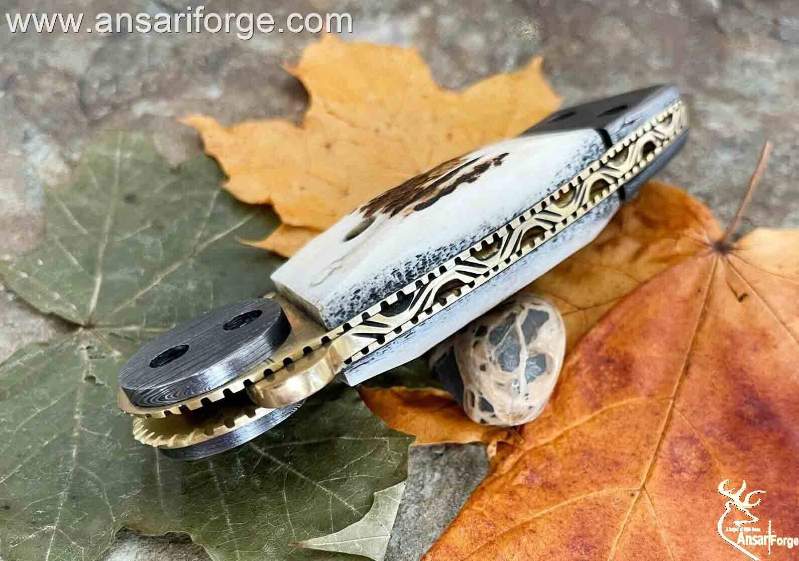 Custom made Damascus steel pocket knife with stag handle
