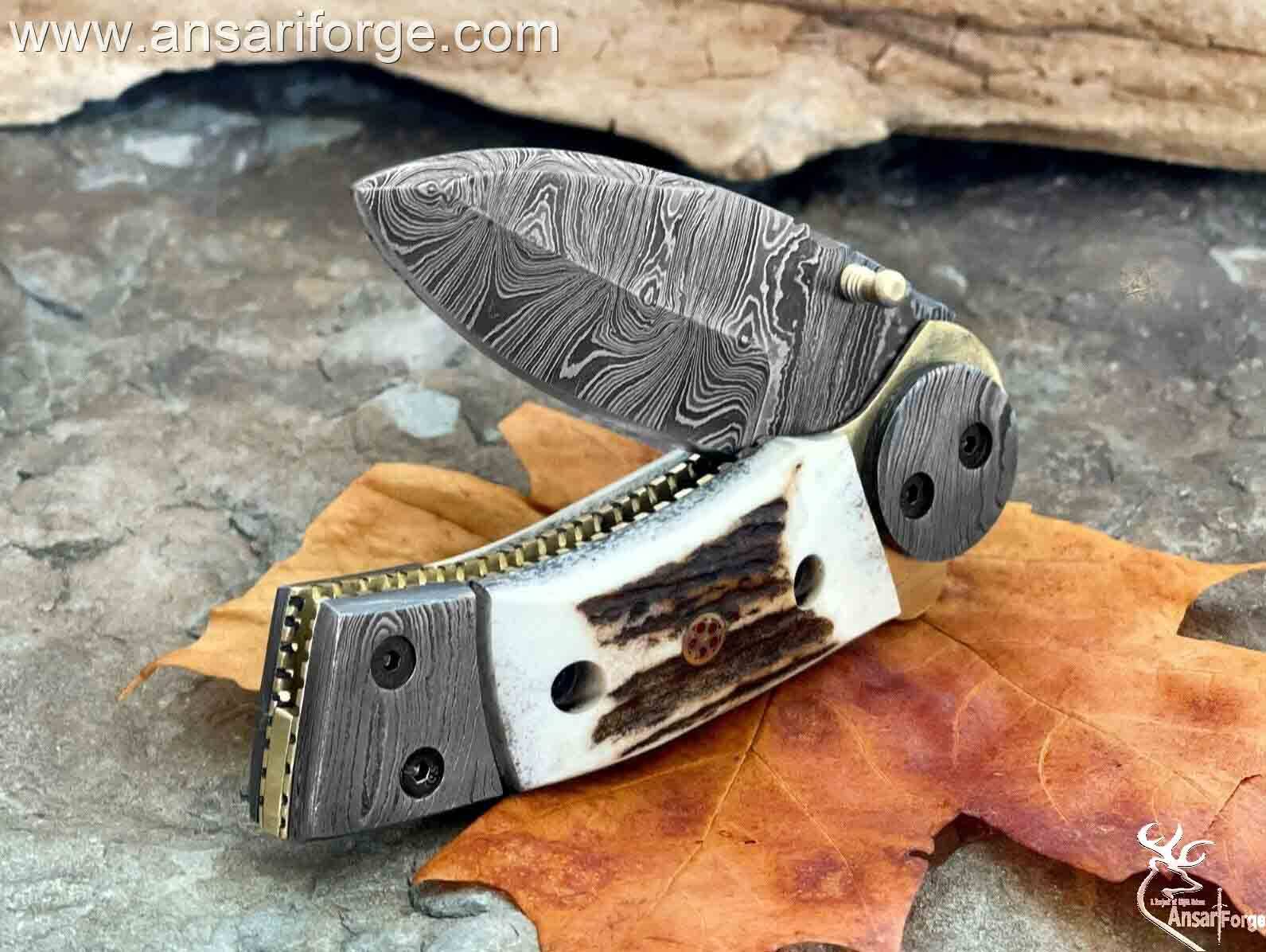 Custom made Damascus steel pocket knife with stag handle
