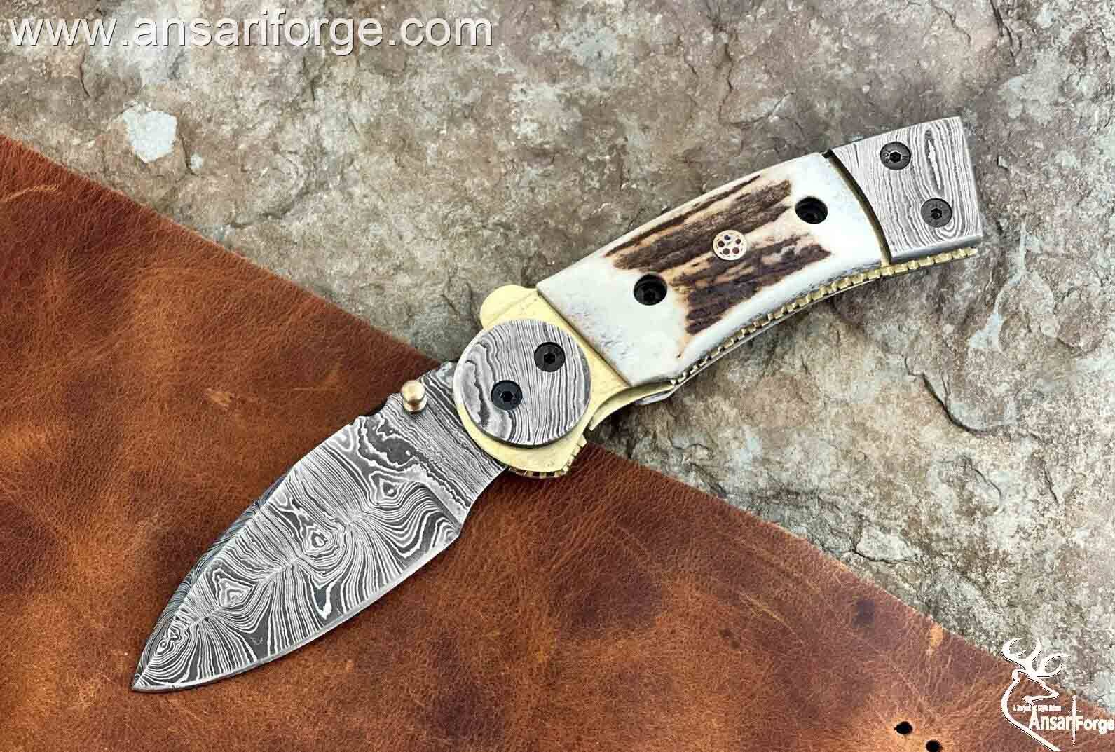Custom made Damascus steel pocket knife with stag handle