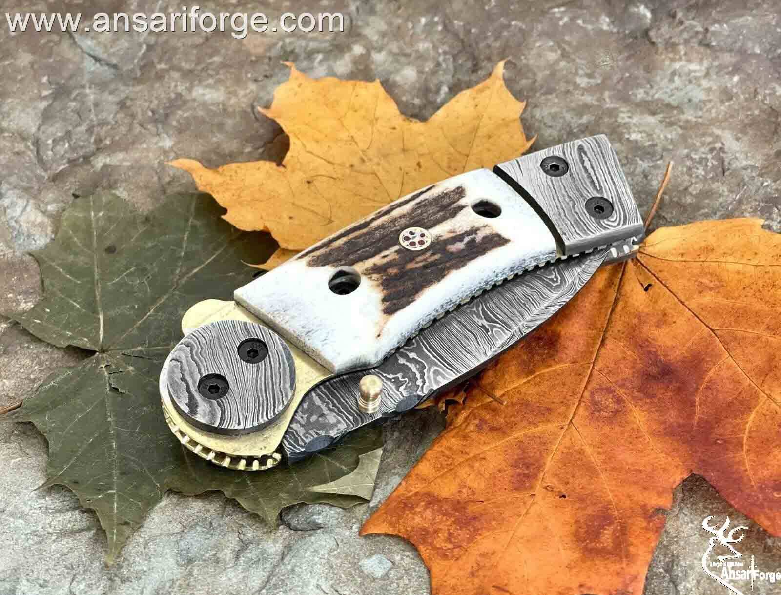 Custom made Damascus steel pocket knife with stag handle