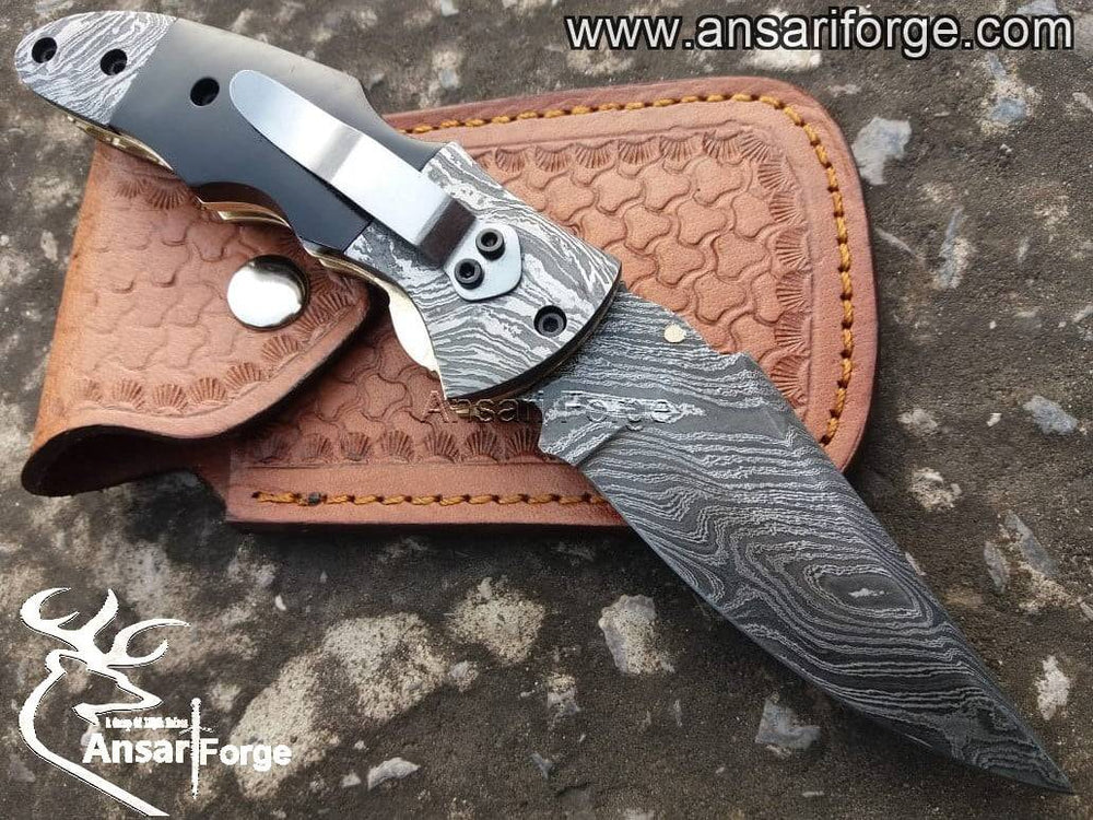 Folding knife with pocket clip and Damascus blade.