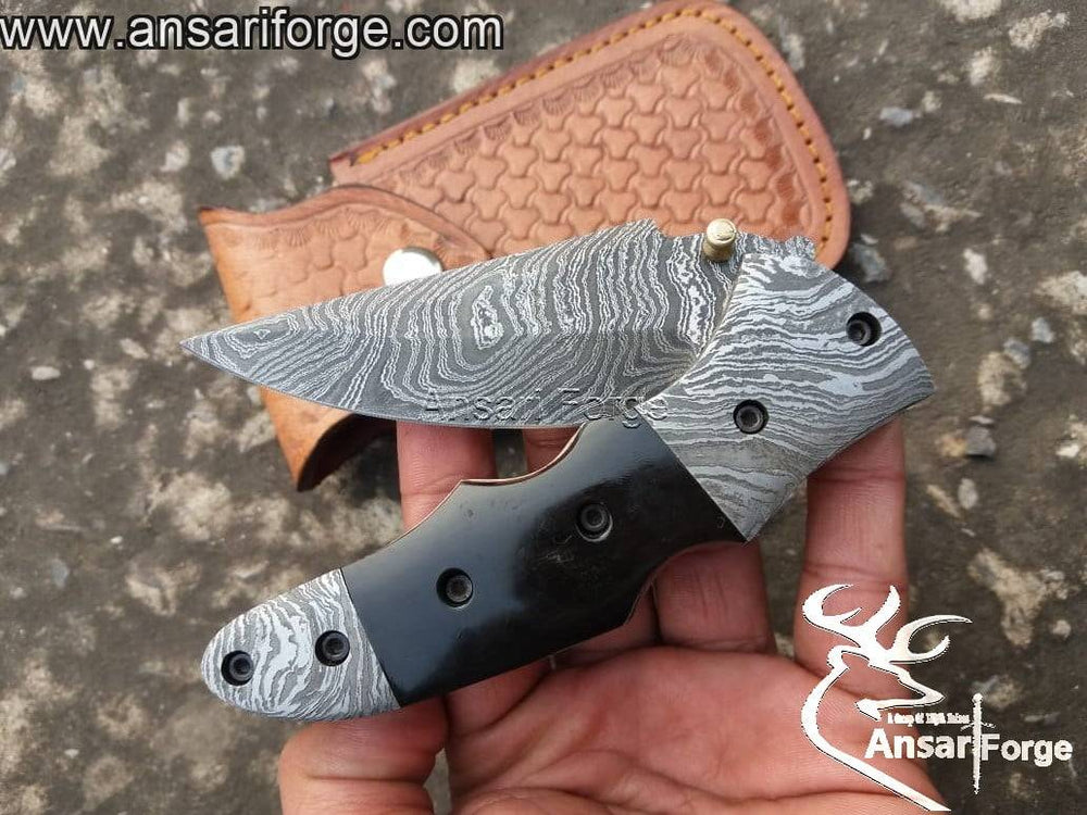 EDC Damascus pocket knife with stainless steel pocket clip.