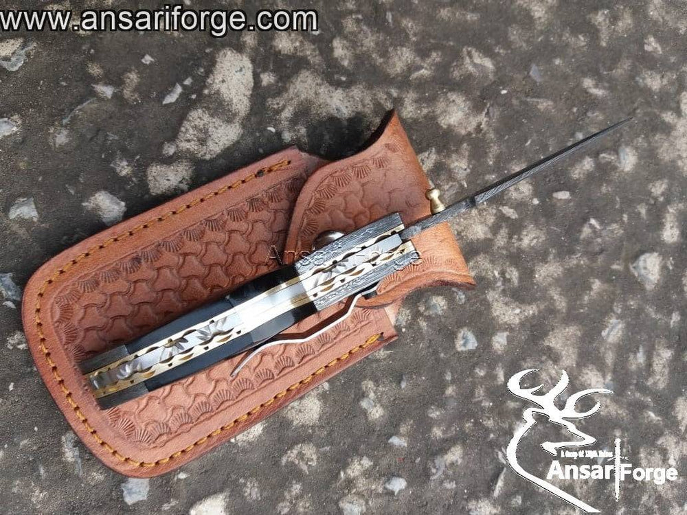 Folding pocket knife with brass frame and file work spine.
