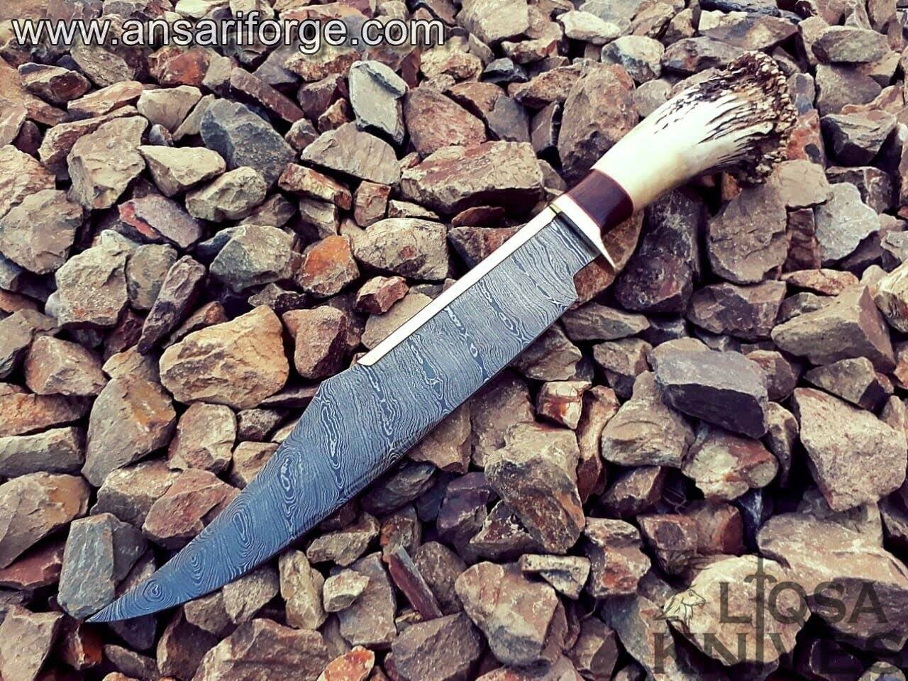 Full tang Bowie Knife with a brass finger guard, stag antler handle, and handmade cowhide leather sheath, perfect for outdoor adventures.