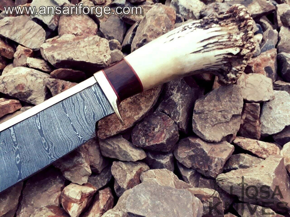 Stag antler handle of Damascus Bowie knife.