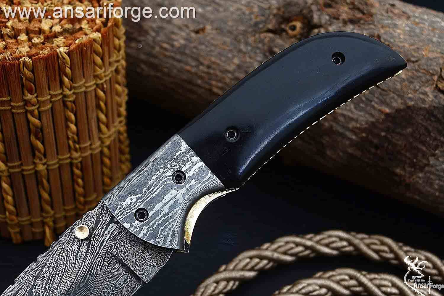 Compact handmade Damascus folding knife for everyday carry.
