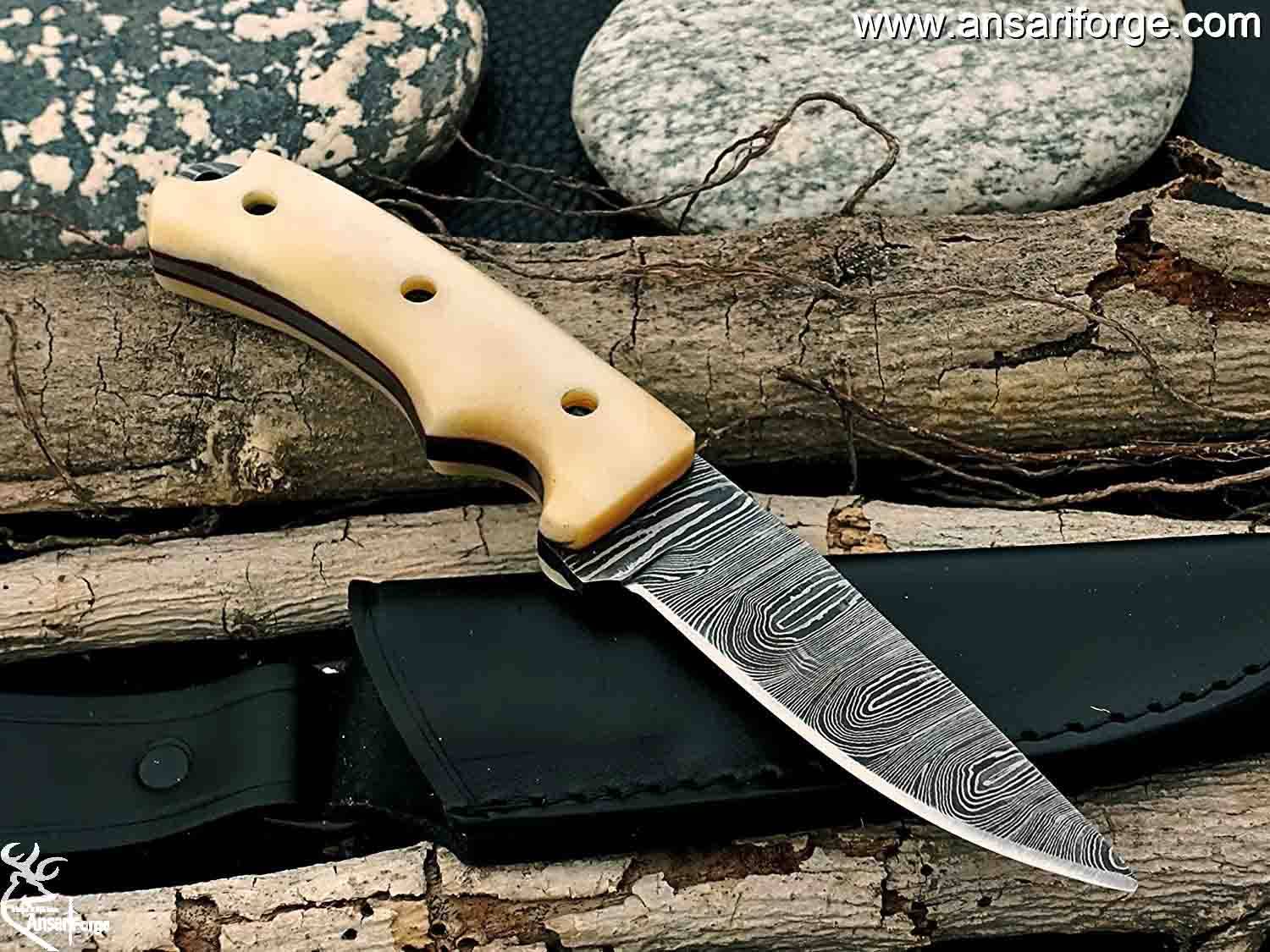 A Damascus steel hunting knife with a leather sheath.