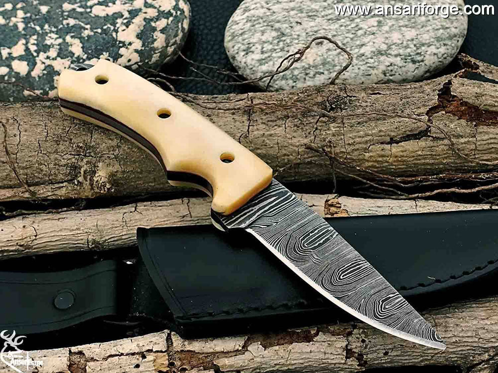 A Damascus steel hunting knife with a leather sheath.