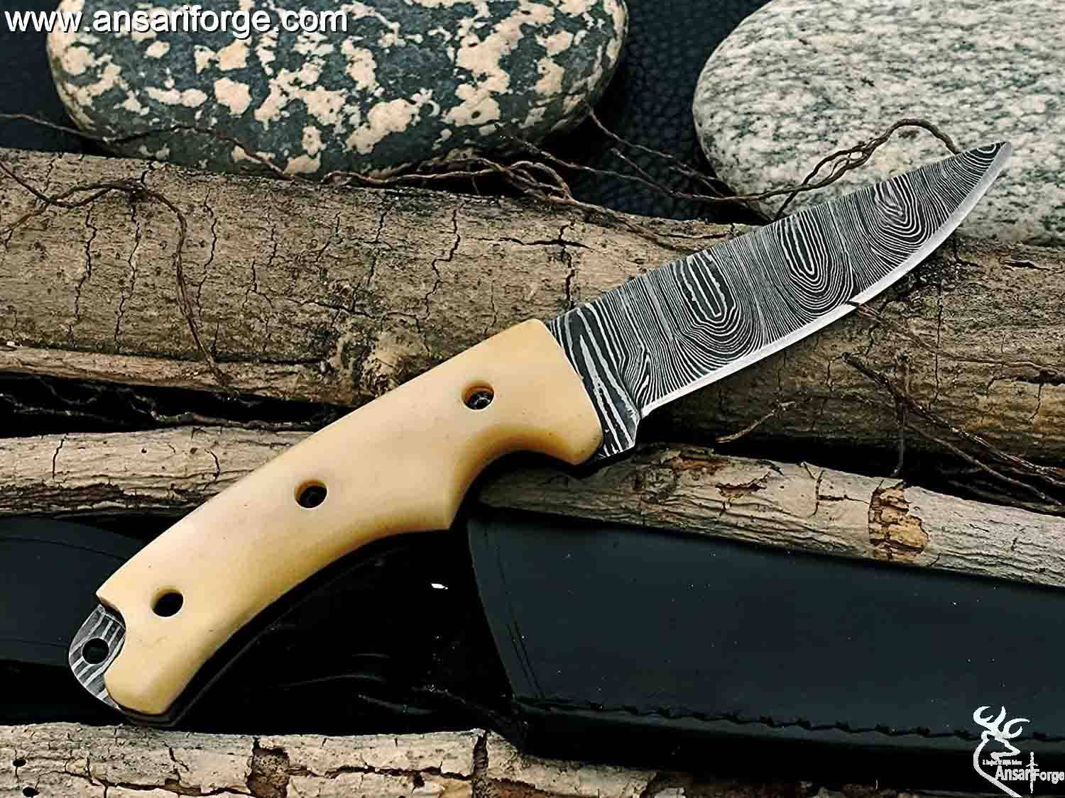Damascus steel hunting knife with a camel bone handle.