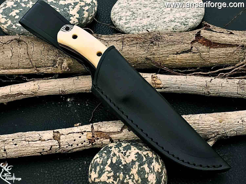 Handmade Damascus steel hunting knife in leather sheath.