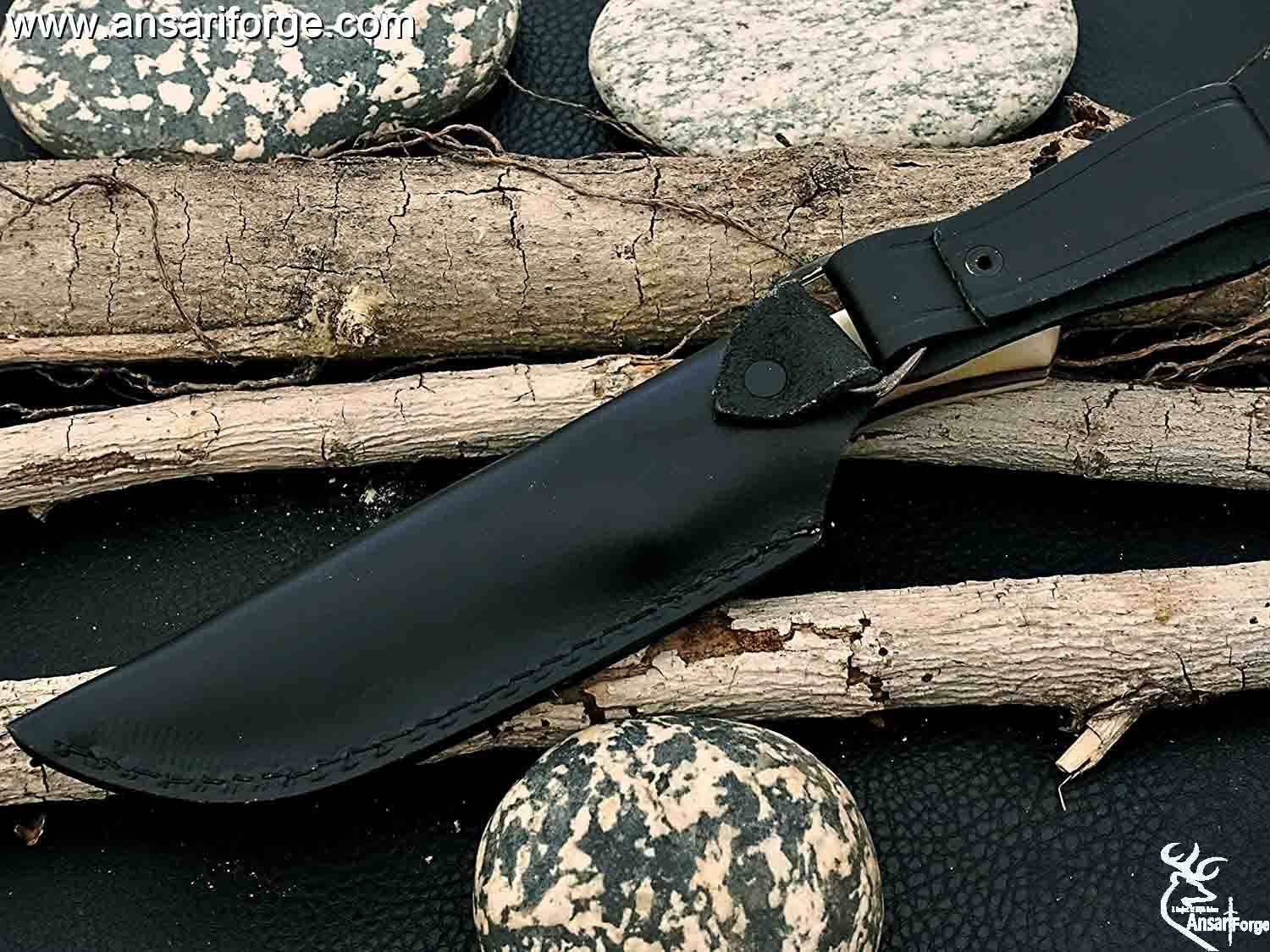 Damascus Skinner knife in its custom made leather sheath.