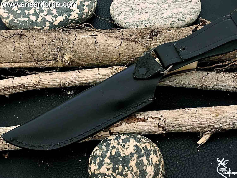 Damascus Skinner knife in its custom made leather sheath.