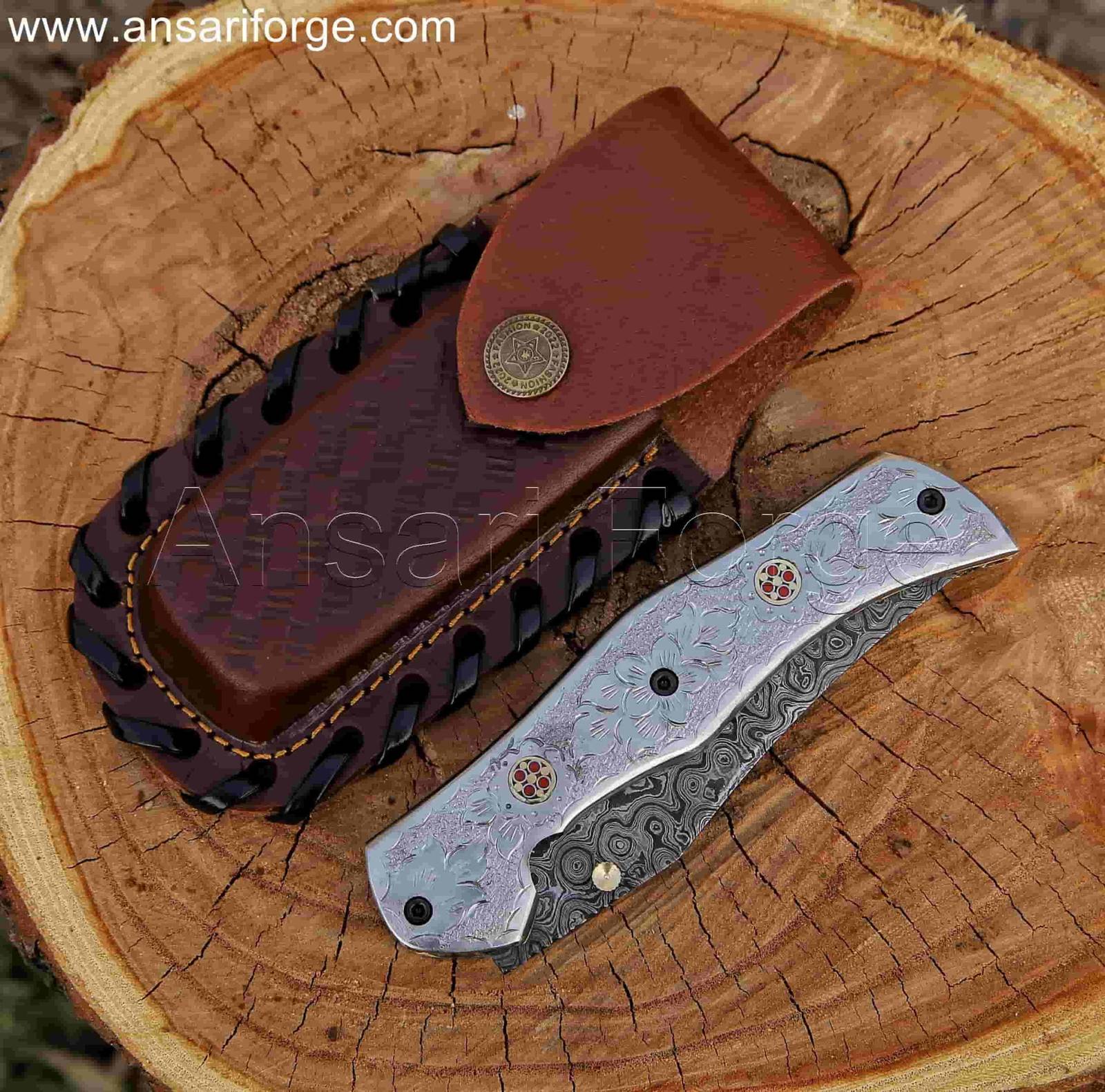 Hand forged Damascus Folding Knife with Raindrop Pattern Blade and Engraved White Copper Handle