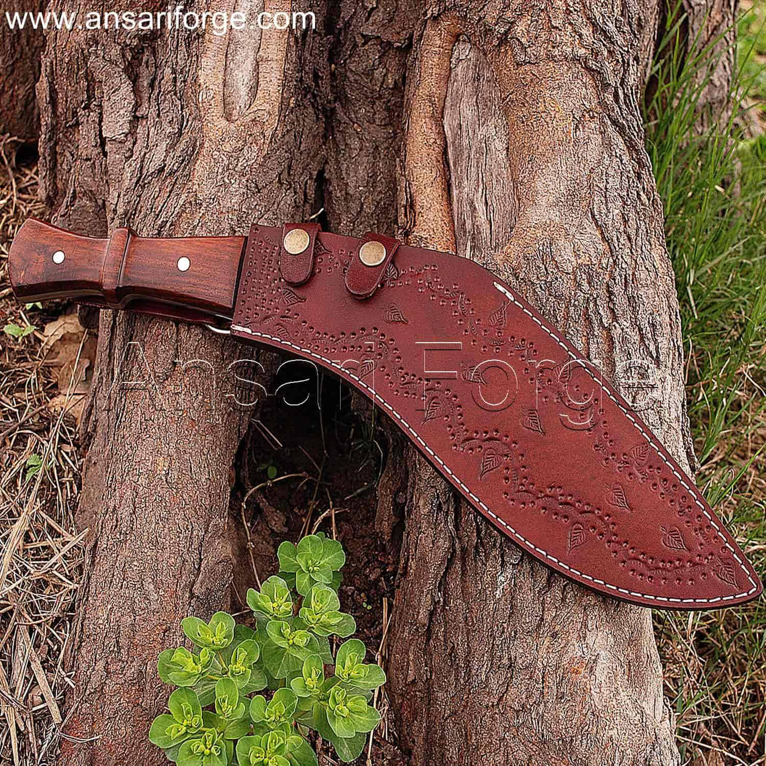 handmade Damascus steel kukri machete. The machete has a curved blade, rosewood handle, in brown leather sheath.