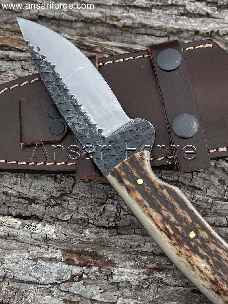 Handcrafted hunting knife with drop point blade and scout carry sheath.