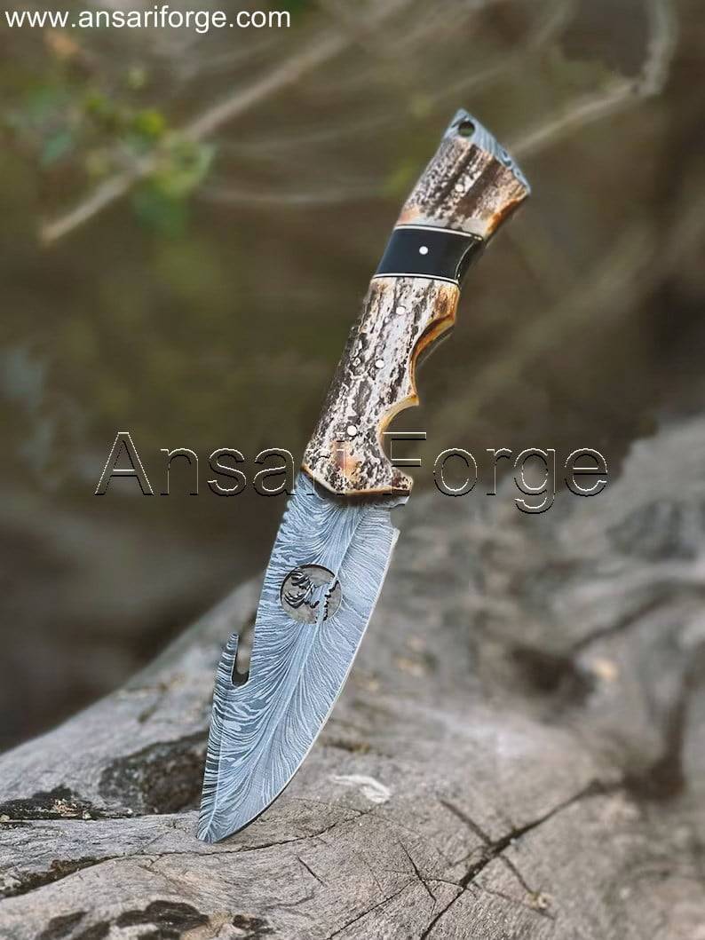 The D-Skinner fixed blade handmade Damascus hunting knife with a comfortable stag antler handle.