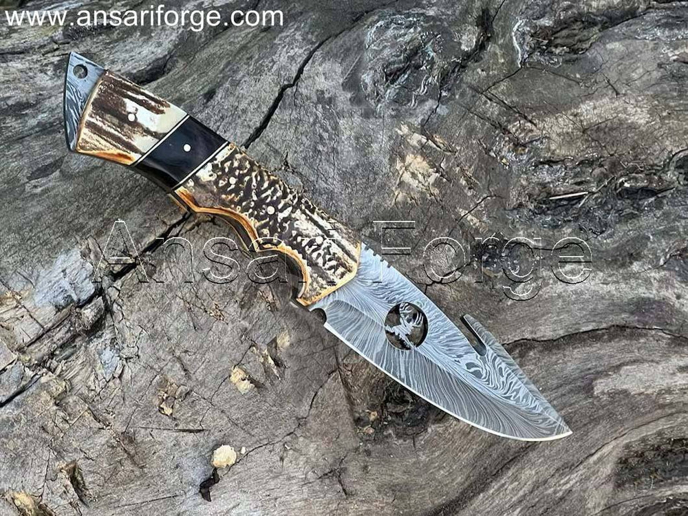 Best Handmade D-Skinner Damascus hunting knife with stag antler handle and leather sheath.