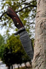 Hand-forged Damascus knife with a twist pattern in brown leather sheath.