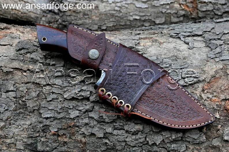 Hand-forged Damascus knife with a twist pattern in brown leather sheath.