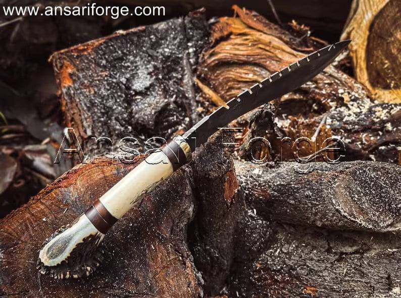 Damascus Steel Best kukri knife with a twist pattern on display. This hand-forged kukri features a brass guard, camel bone and stag antler handle, and a genuine leather sheath.
