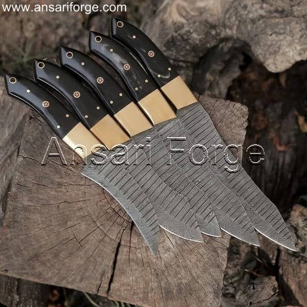 Five gleaming Pro Damascus Chef Knives made from high-carbon Damascus steel, showcasing their wavy pattern and razor-sharp edges.
