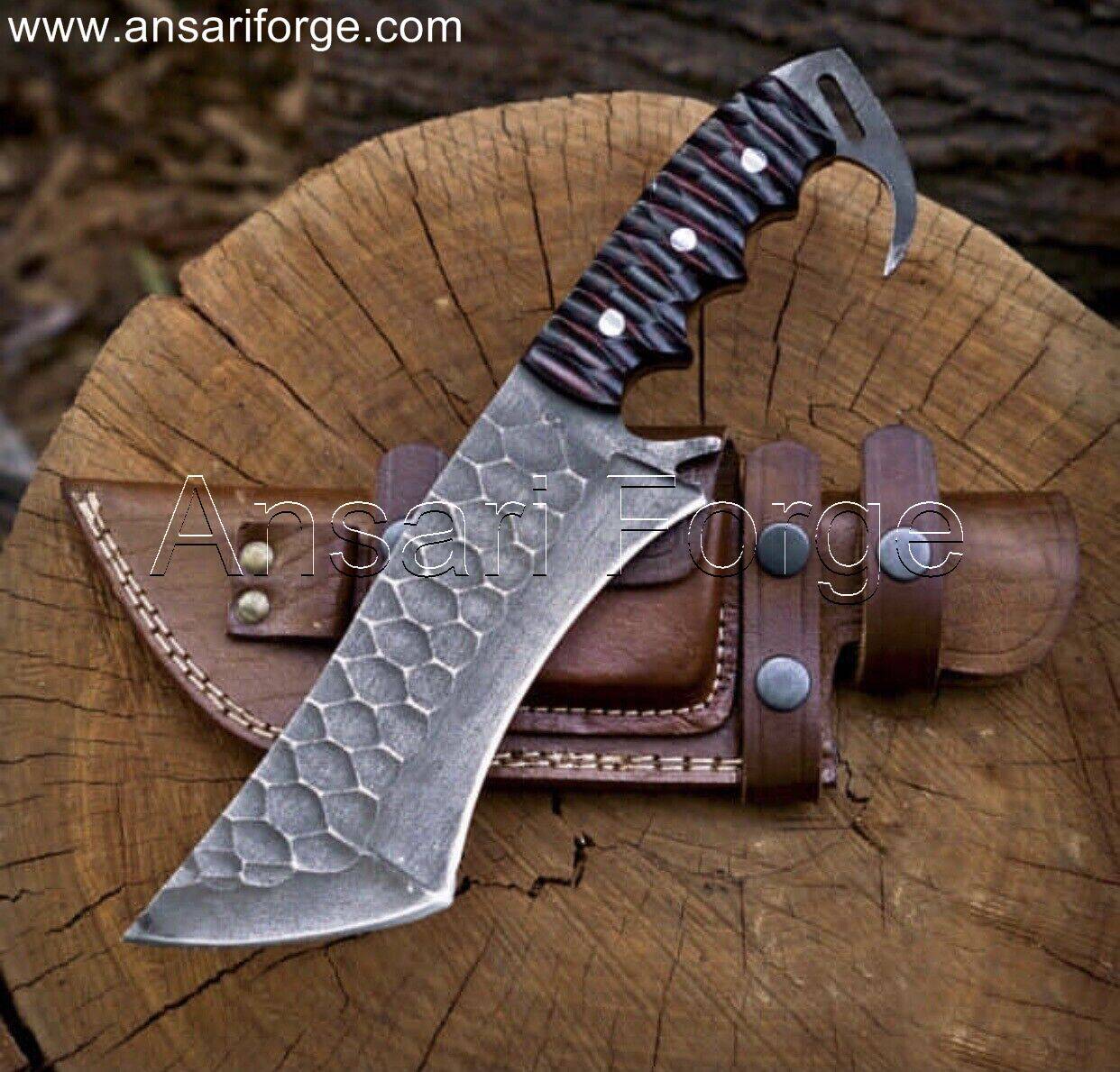Full-size tracker knife with a 65MN high carbon steel blade, tanto tip, micarta handle, and horizontal draw scout carry cowhide leather sheath.