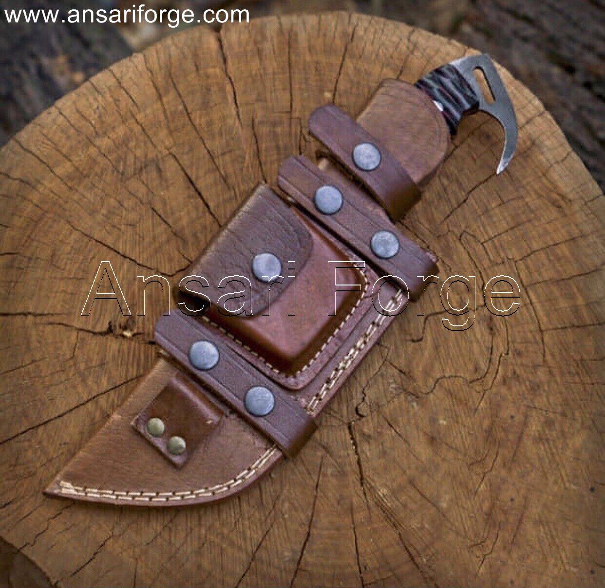 Tracker Knife securely placed in its high-quality cowhide leather sheath, ready for easy horizontal draw scout carry.