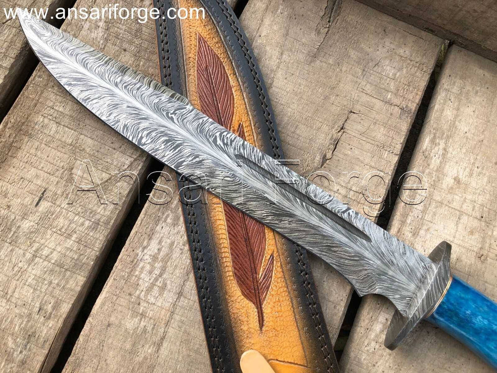 Hand-forged Feather Damascus Bowie Knife on Wooden Background
