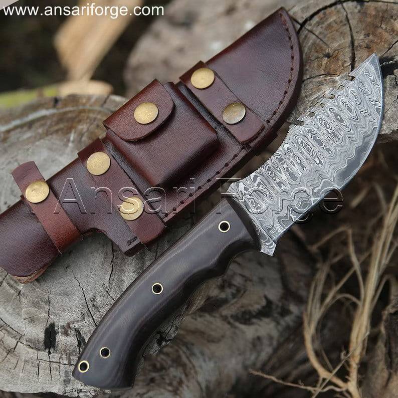 ull view of the Tracker Knife with hand-forged Damascus steel blade and G10 handle.