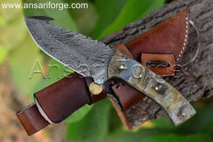 Hand-forged Skinner's Edge Damascus Gut Hook Knife with beautiful twist pattern, ideal for deer hunting. Shown with brown leather sheath.