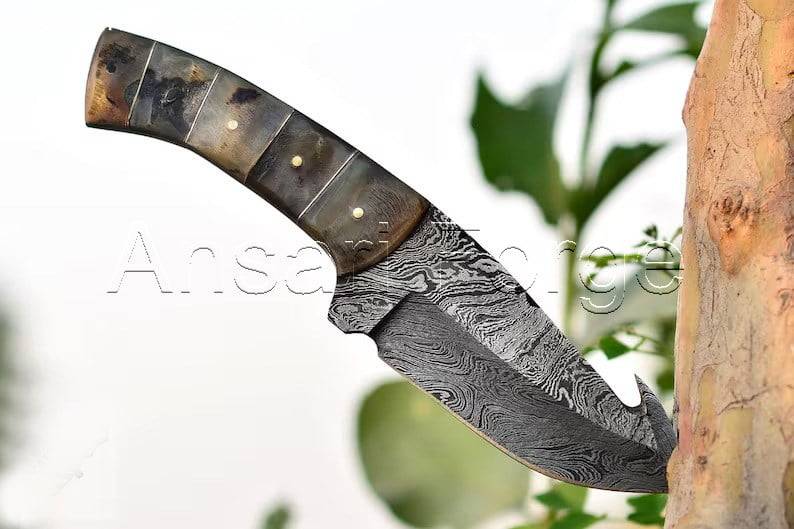 Beautiful Damascus Skinning Knife with Gut Hook, Ram Horn Handle, and Leather Sheath