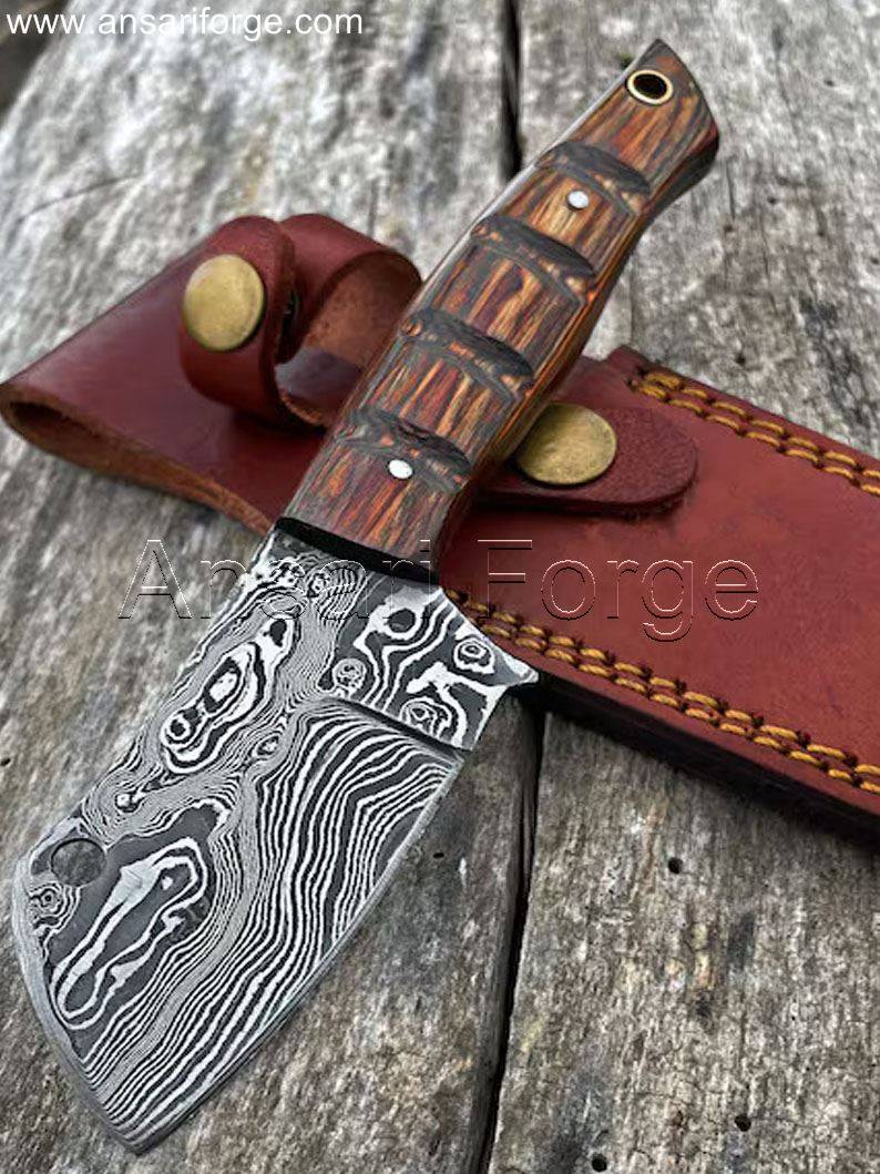 Damascus Bushcraft Knife with raindrop pattern, leather sheath, and Pakkawood handle.