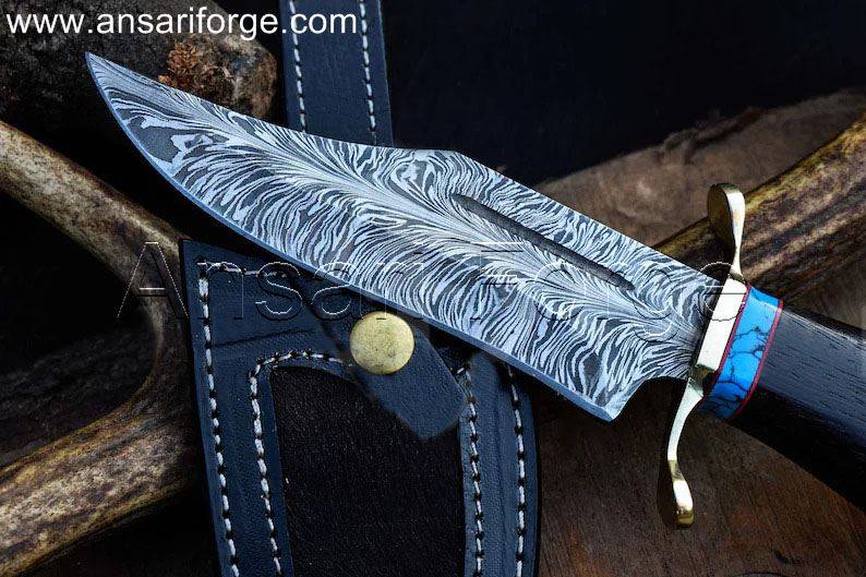 Close-up of the Handmade Feather Damascus Knife's 7.0-inch blade with 480 layers and a 56 HRC hardness rating.