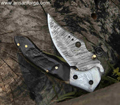 Damascus Pocket Knife by Ansari Forge with a 1095 & 15n20 Damascus steel blade, Himalayan sheep horn handle, and brass frame. Featuring a fire pattern, liner lock mechanism, and leather sheath.