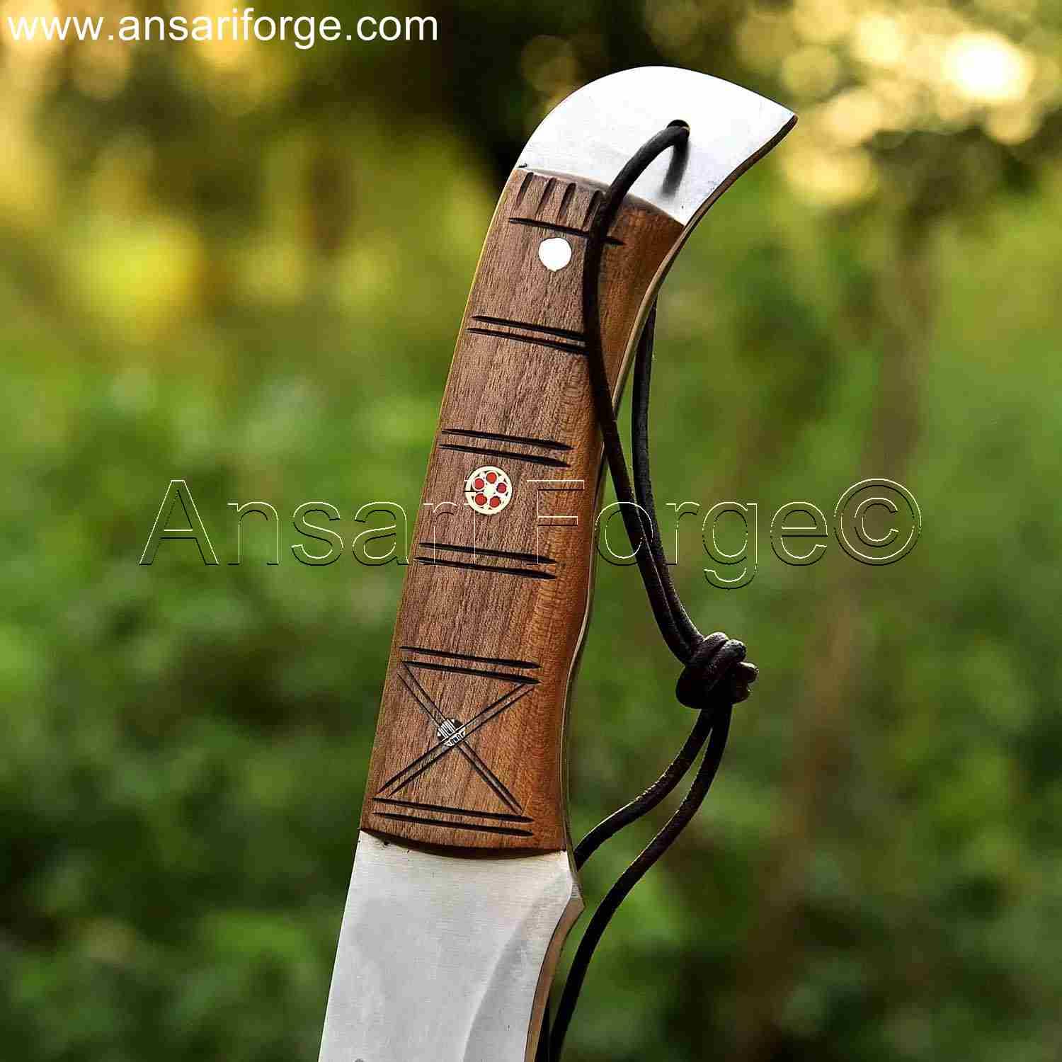 Walnut wood handle of machete knife for outdoor use.